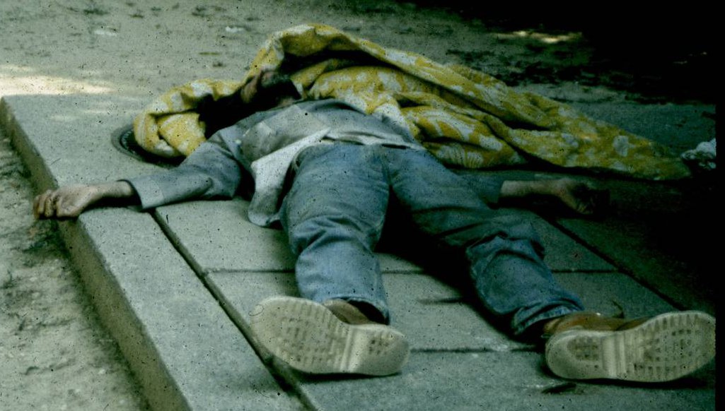 homeless man on grate