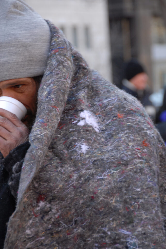 Homeless man with blanket