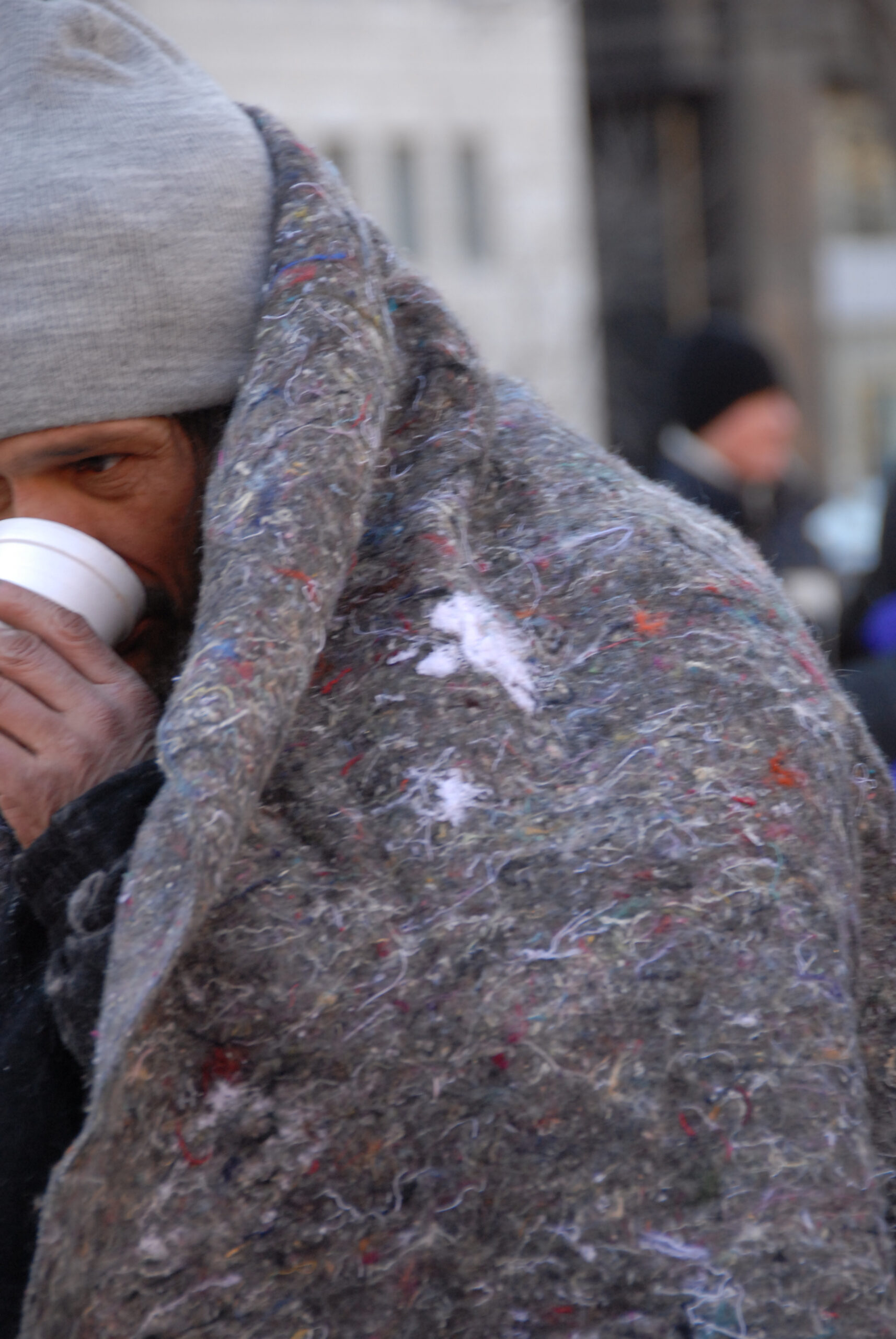Homeless man with blanket